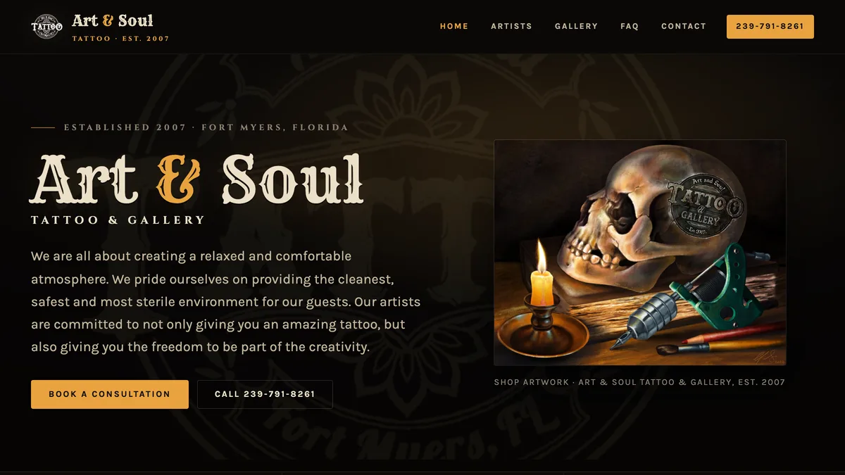 Art and Soul Tattoo homepage: the shop name in a cream western display face with an amber ampersand, on a near black background beside a painting of a skull, a candle and a tattoo machine.