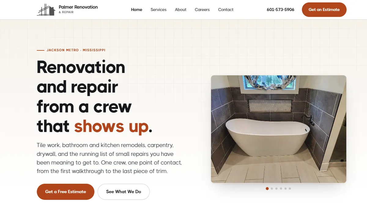 Palmer Renovation homepage: a large headline reading Renovation and repair from a crew that shows up, on a warm off white background beside a photograph of a finished bathroom remodel.